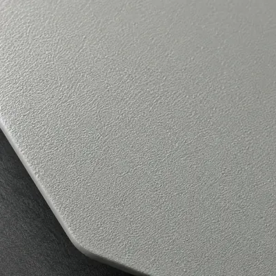 Light grey sand texture powder coating, macro