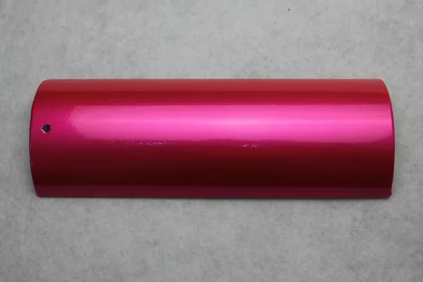 Translucent magenta, high gloss powder coating on an aluminium profile section